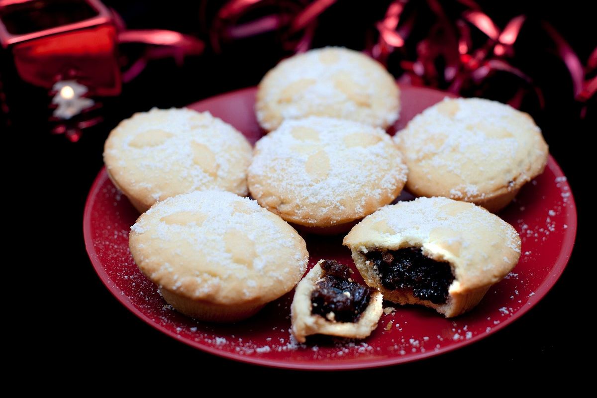 A plate of mince pies dusted with icing sugar