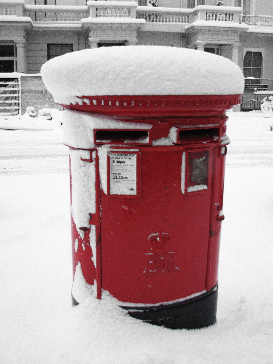 A red pillar box in the snow
